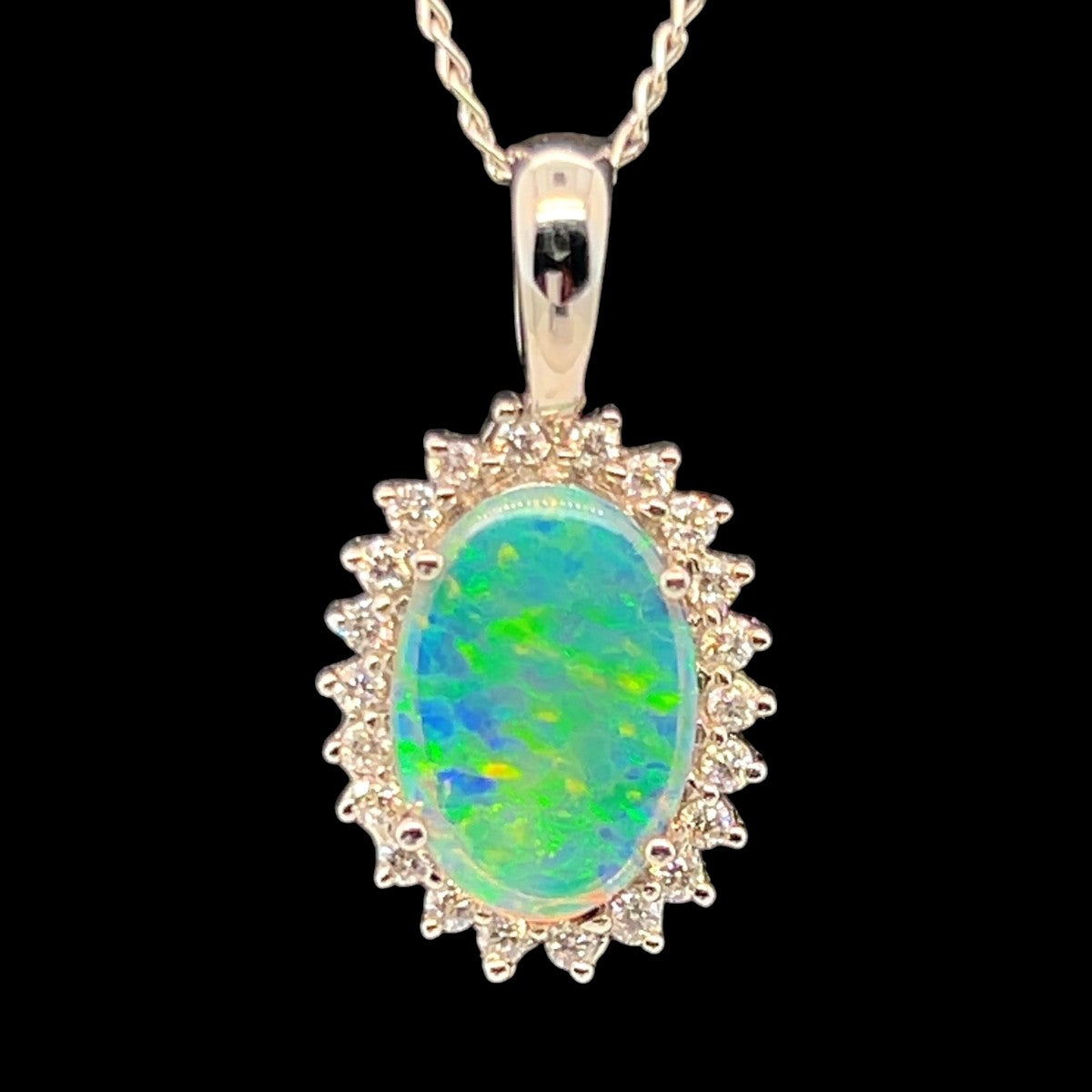 18ct White Gold Solid Opal Pendant Surrounded by Diamonds (sp3387) 18ct White Gold Solid Opal Pendant Surrounded by Diamonds (sp3387)