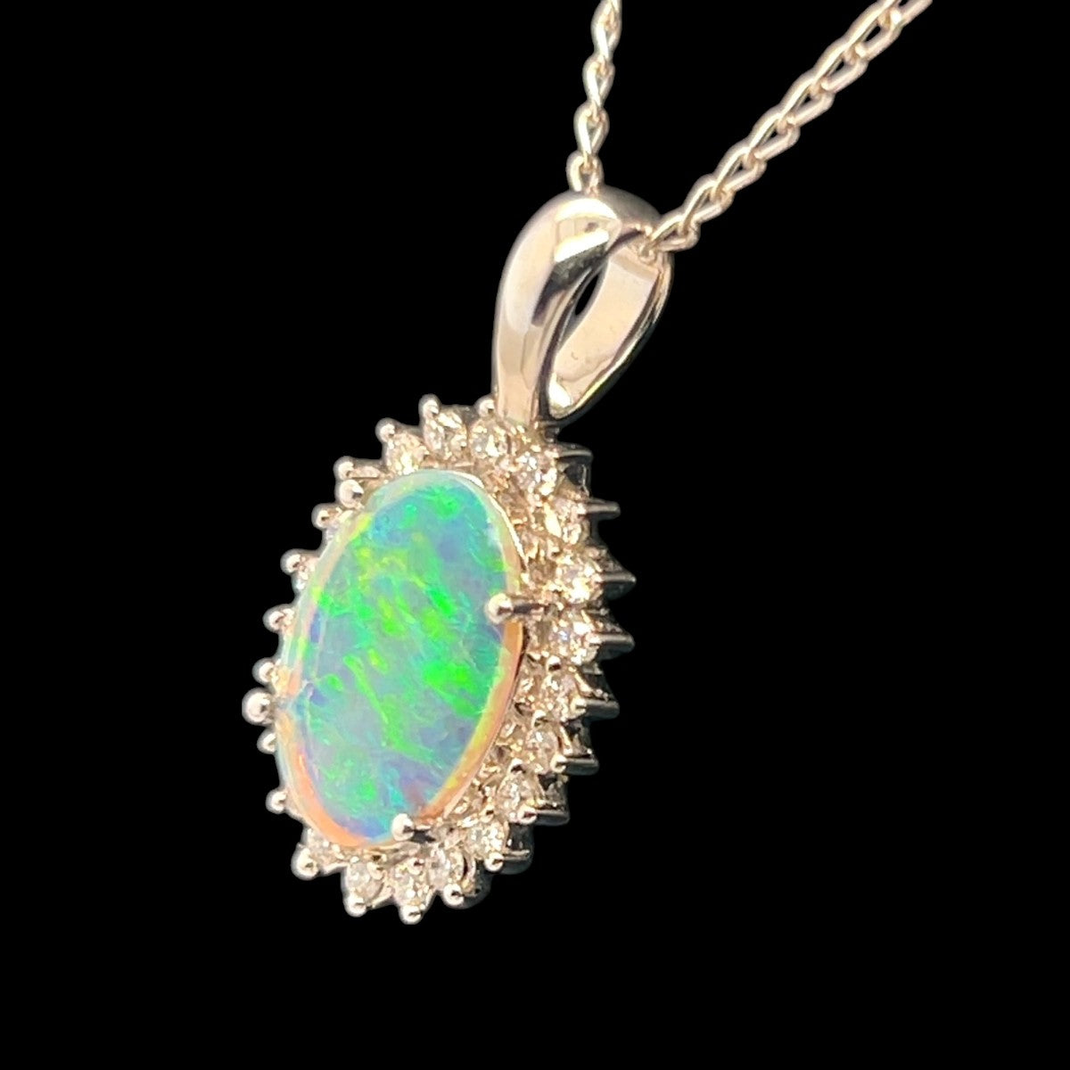 18ct White Gold Solid Opal Pendant Surrounded by Diamonds (sp3387) 18ct White Gold Solid Opal Pendant Surrounded by Diamonds (sp3387)