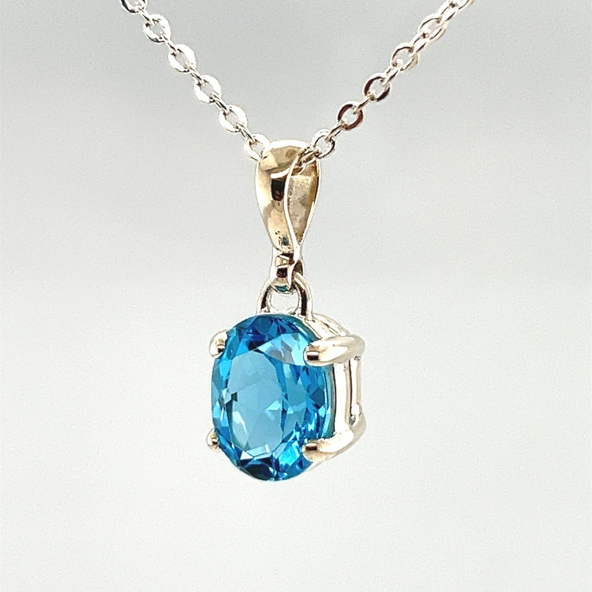 Sterling Silver Blue Topaz Pendant (stp900)