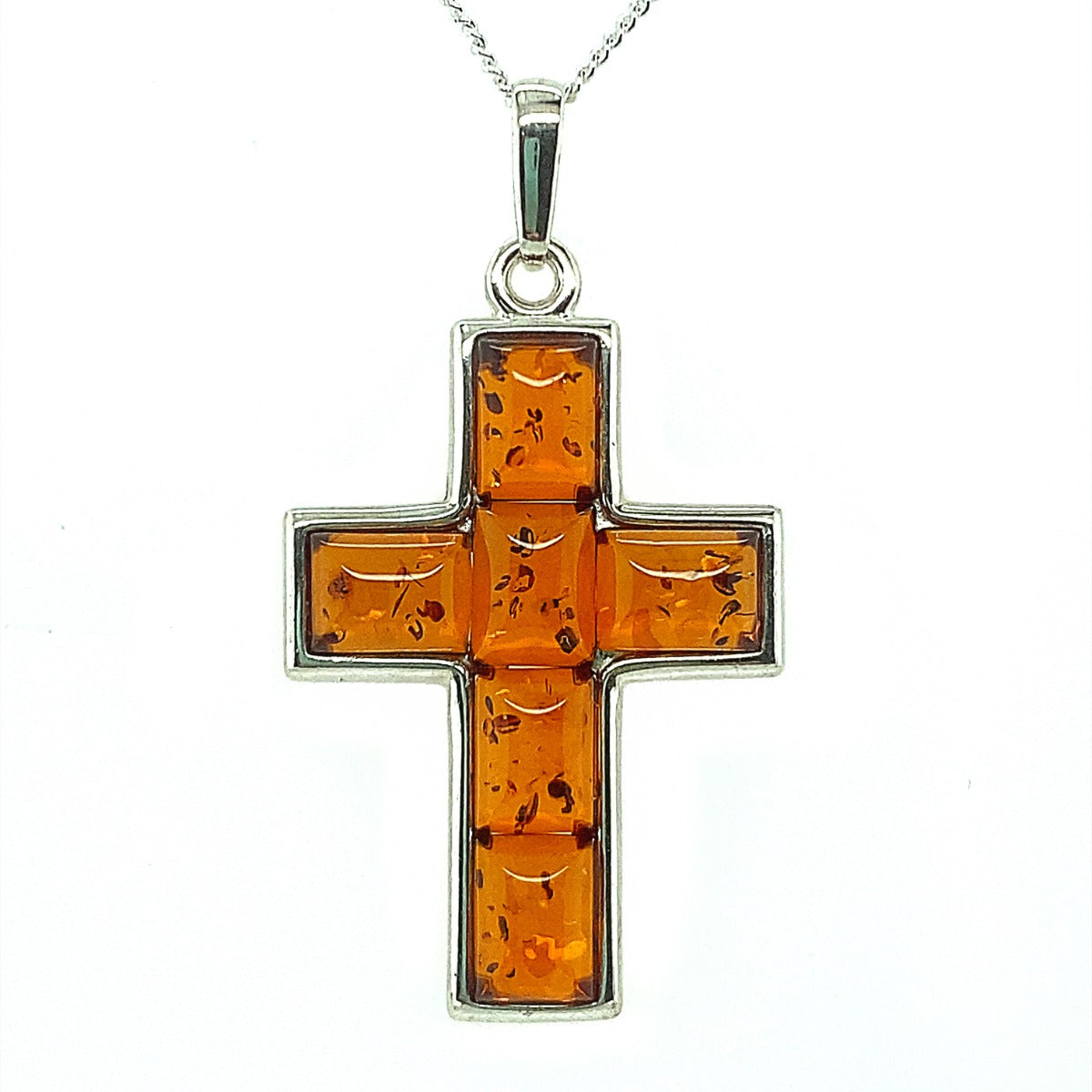 6 Pieces of amber set in Silver in the Shape of a Cross