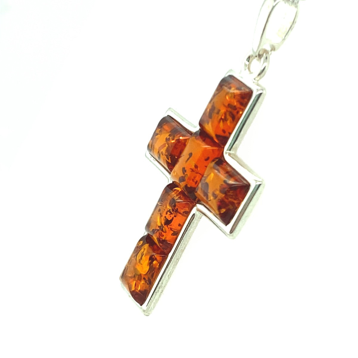 6 Pieces of amber set in Silver in the Shape of a Cross