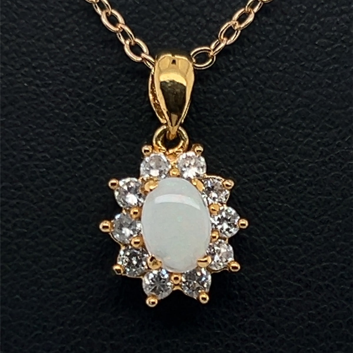 Gold plated solid opal pendant surrounded by cut crystrals (gpsp8131)