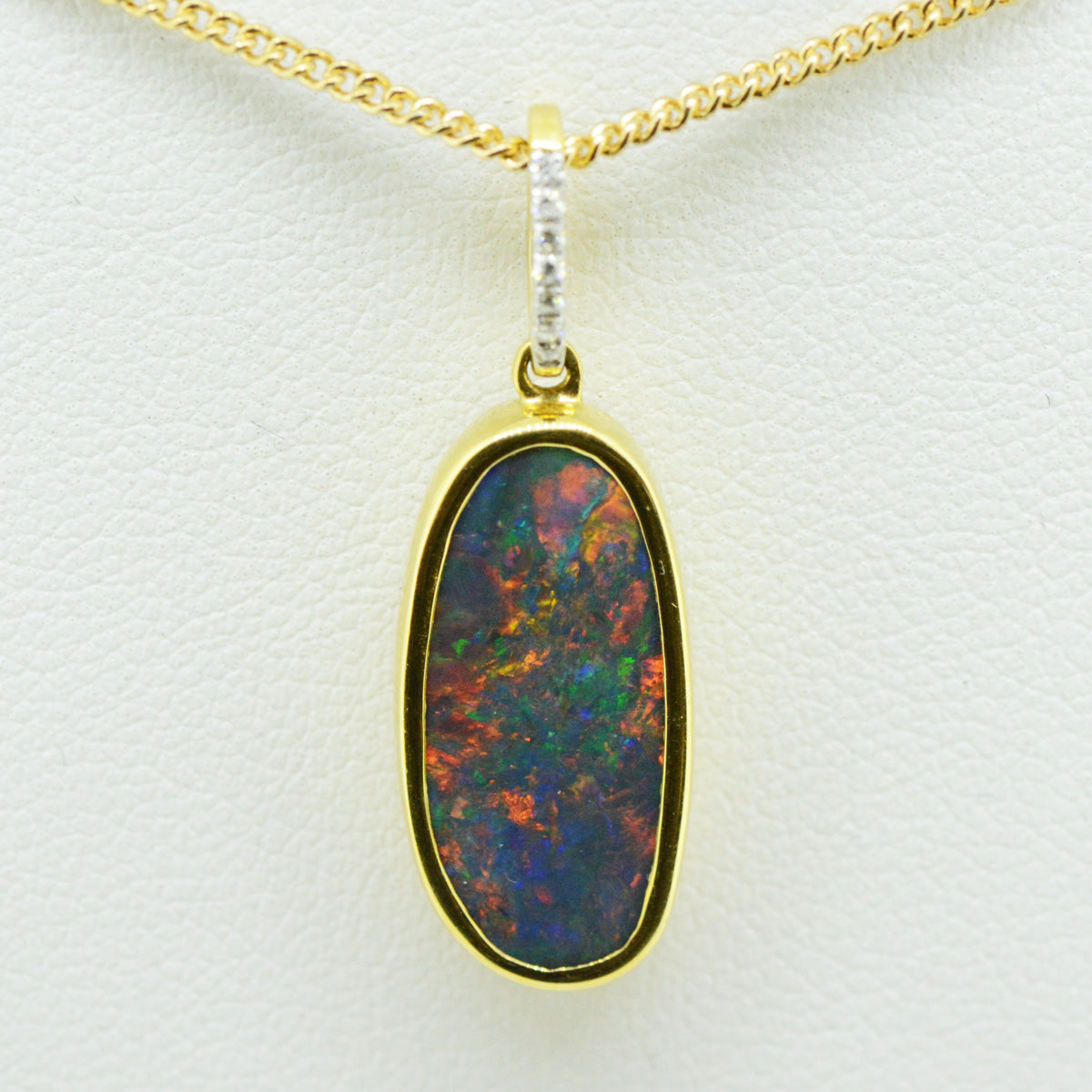 18ct Yellow Gold Solid Black Opal Pendant set with 7 Brilliant Cut Diamonds