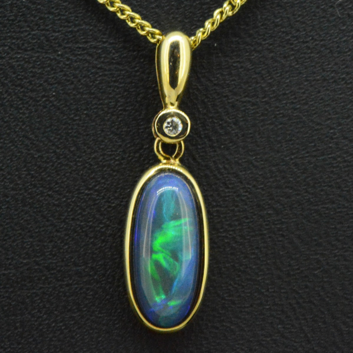 9ct yellow gold black opal pendant (13mmx6mm)