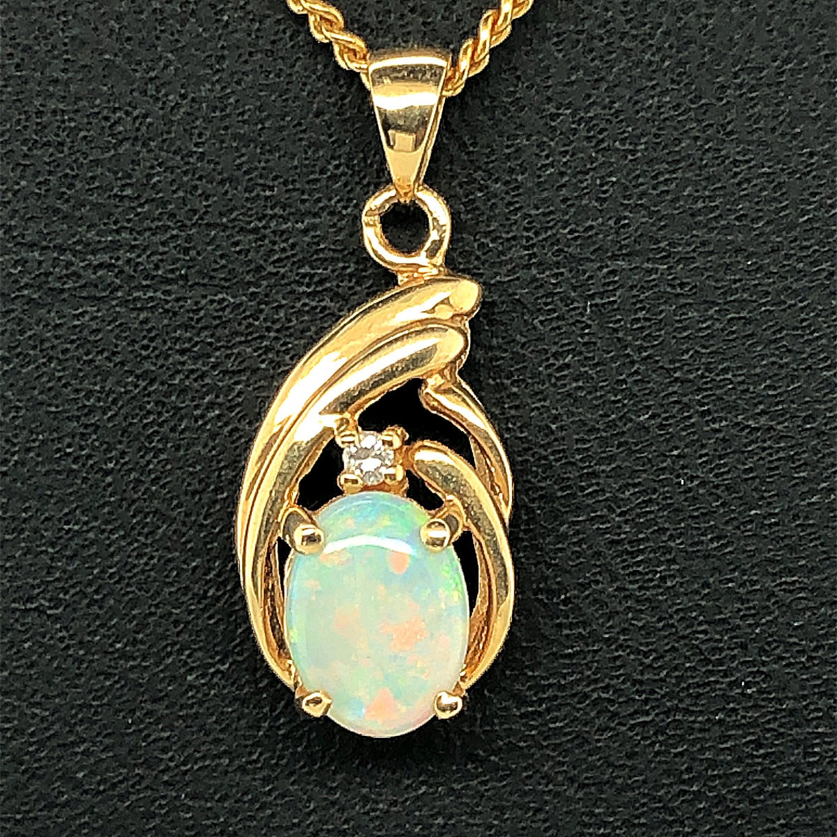 18ct Yellow Gold  Claw Set Solid Opal Pendant with one diamond